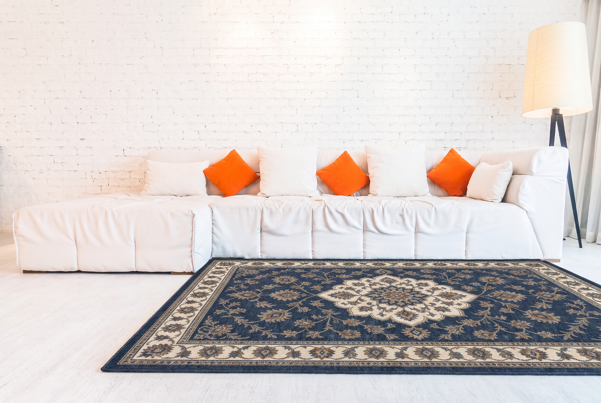 Navy Floral Medallion Rug, hand-tufted wool with navy medallion and ivory scrolling vine border, second room view