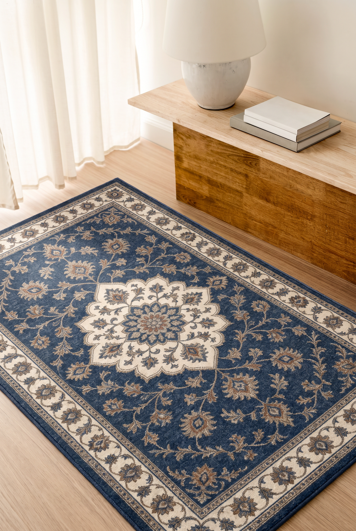 Navy Floral Medallion Rug, hand-tufted wool with navy medallion and ivory scrolling vine border, close-up view