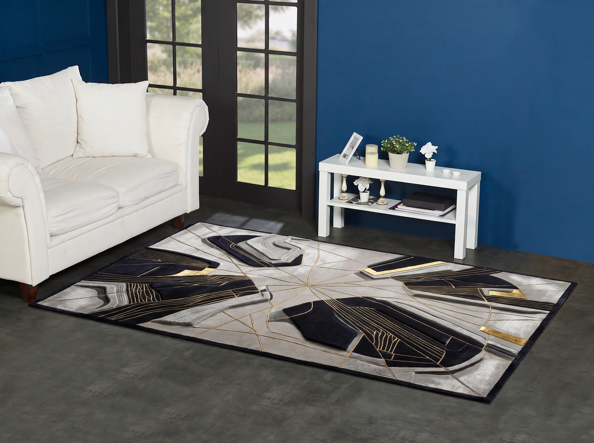 Black Gold Fracture Rug, hand-tufted with gold radiating lines and carved black and grey abstract forms, alternate room view