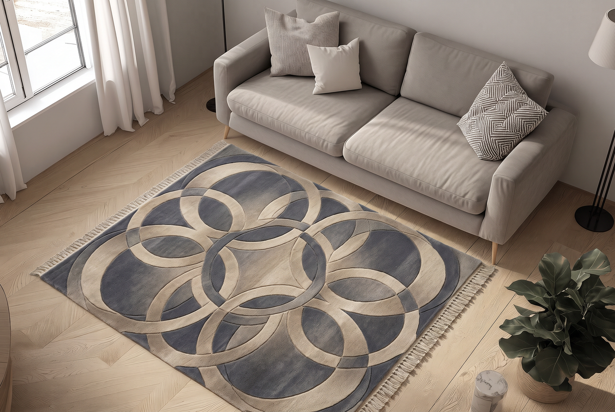 Slate Interlocking Rings Rug, hand-tufted wool with overlapping sand circles on slate blue, close-up view