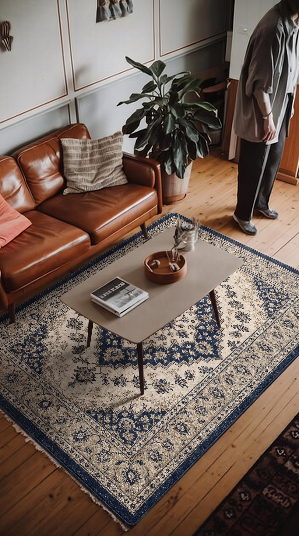 Beige hand-tufted wool rug with a Heriz-inspired angular navy medallion and a beige and navy border