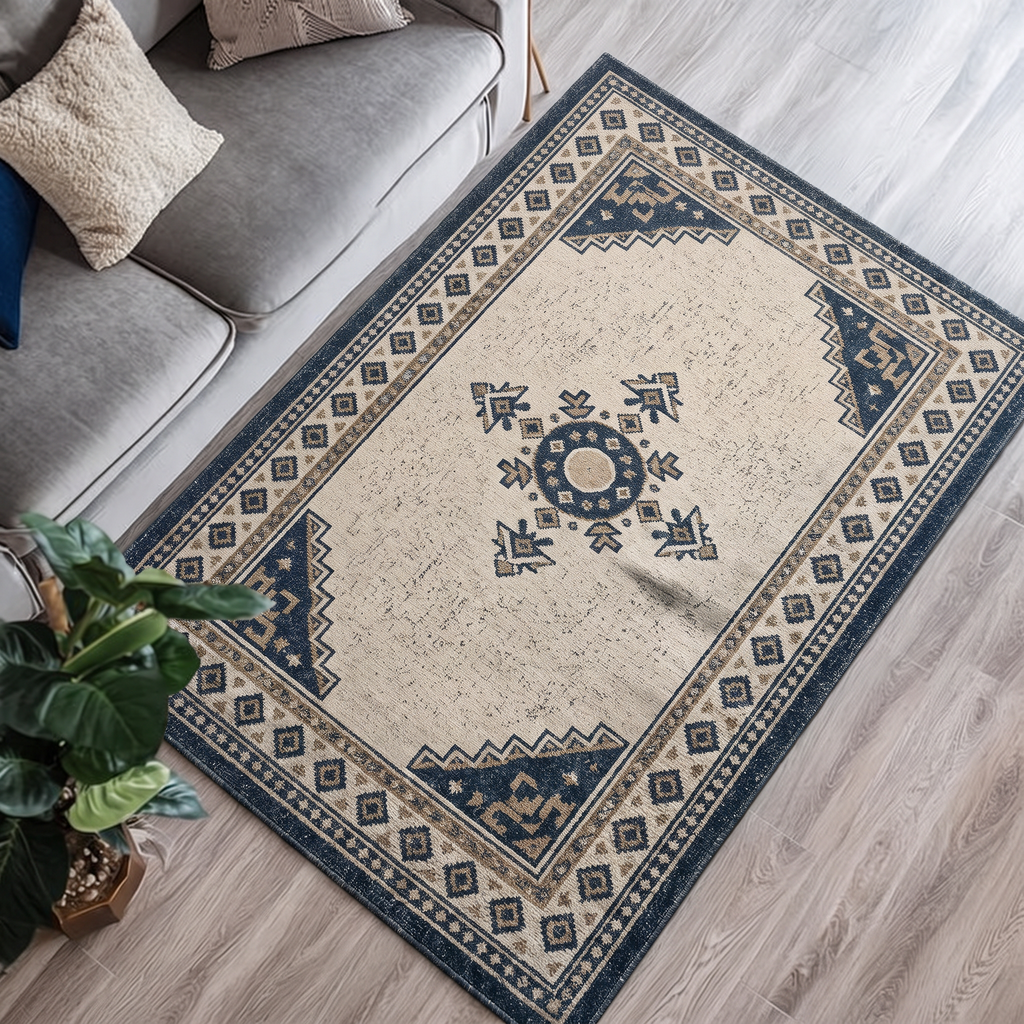 Ivory hand-tufted wool rug with a kilim-inspired charcoal star motif and a charcoal geometric border