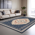 Navy hand-tufted wool rug with an ivory folk-style medallion of rust and blue leaf sprigs