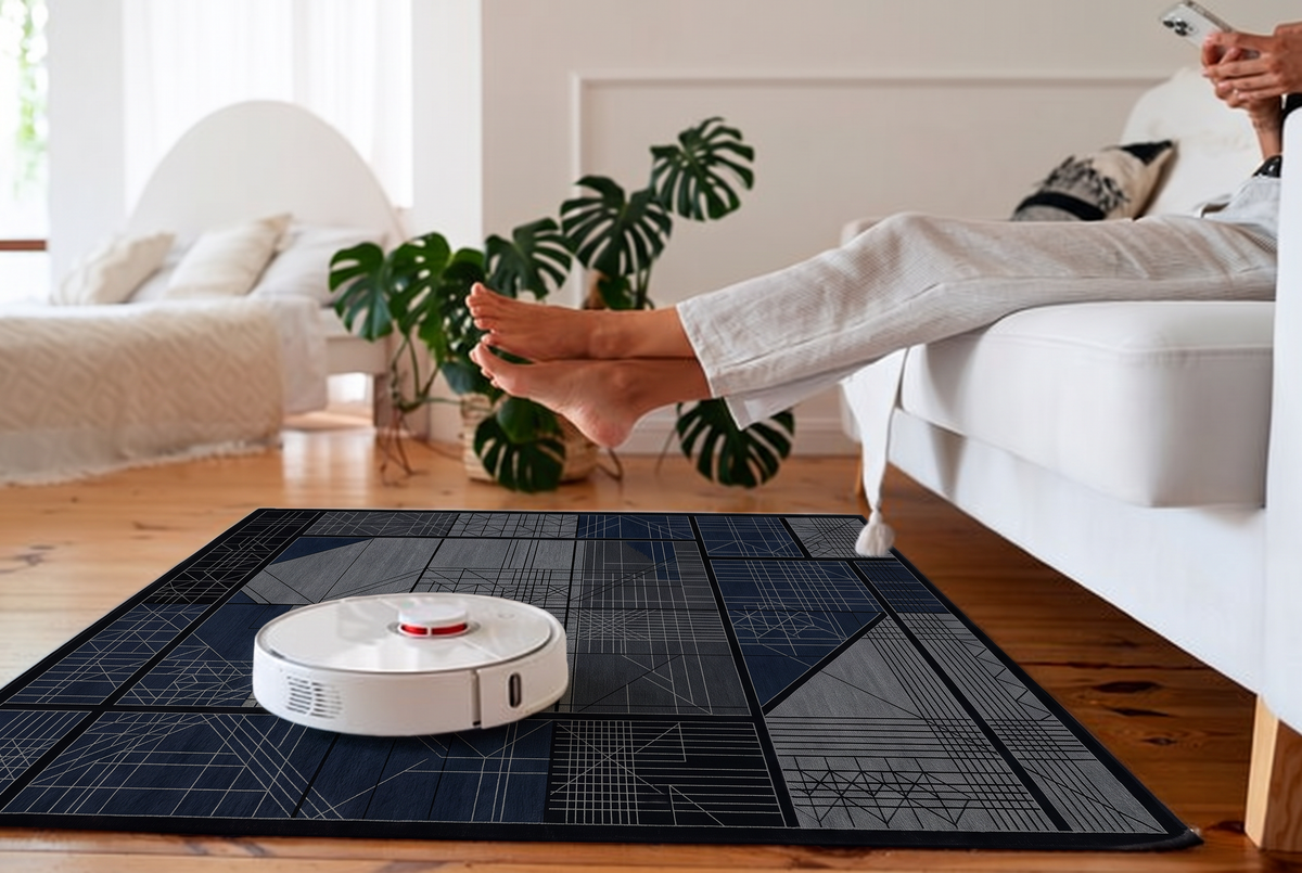 Midnight Blueprint Grid Rug, hand-knotted Indo-Nepali wool with a black grid of charcoal, grey and navy panels in fine blueprint line work, detail view